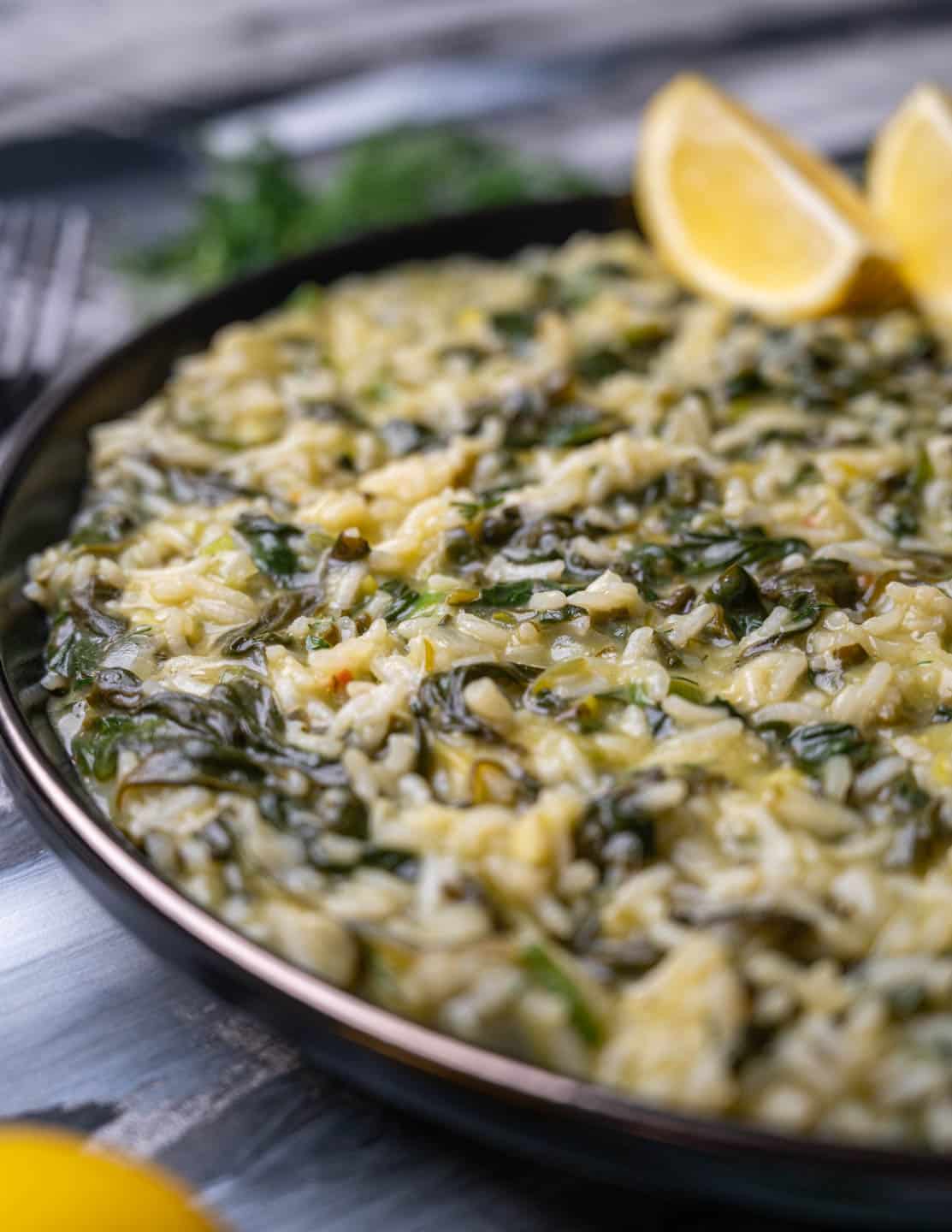 a plate of rice with spinach