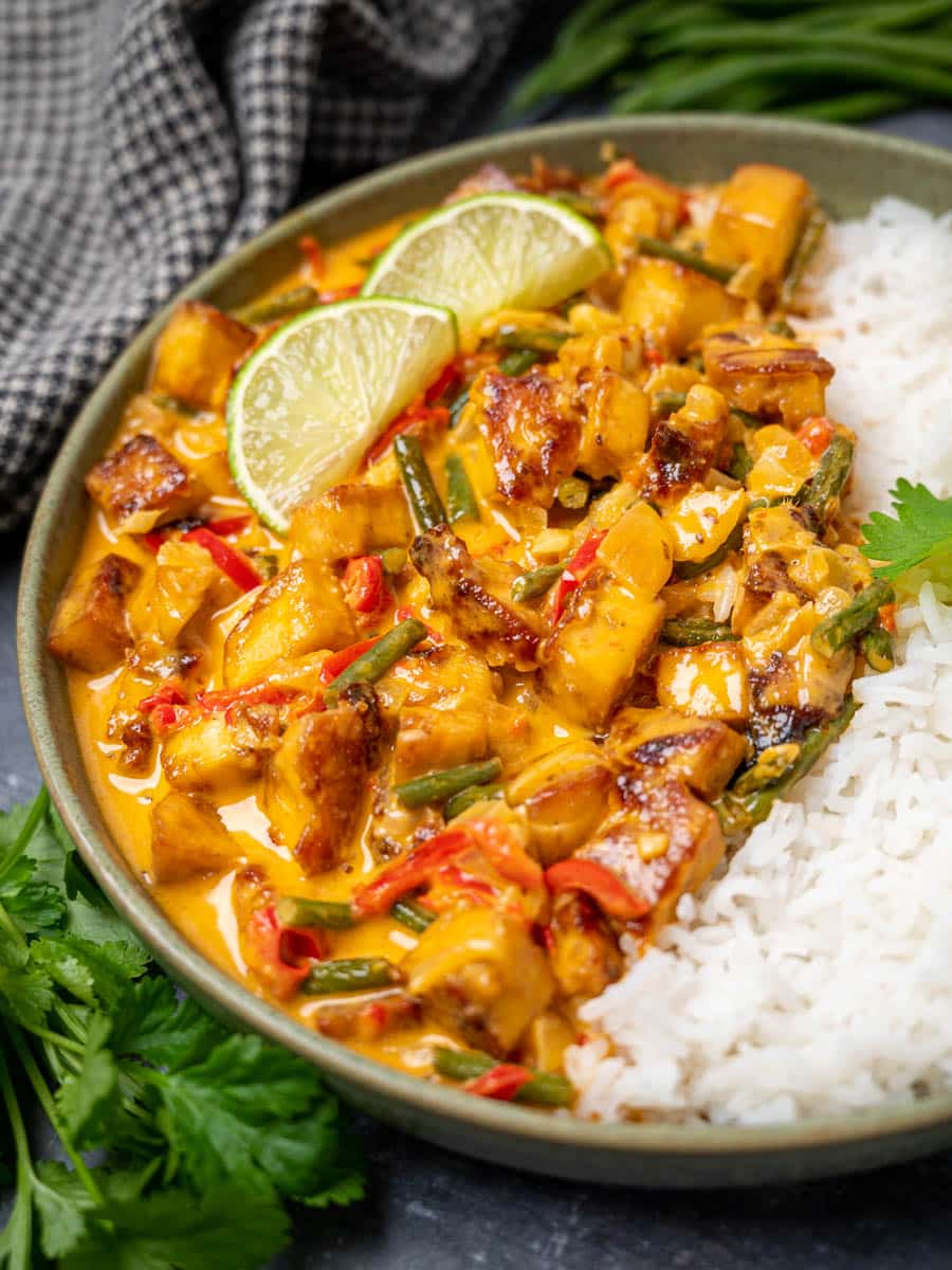 close up photo of a tofu Thai red curry