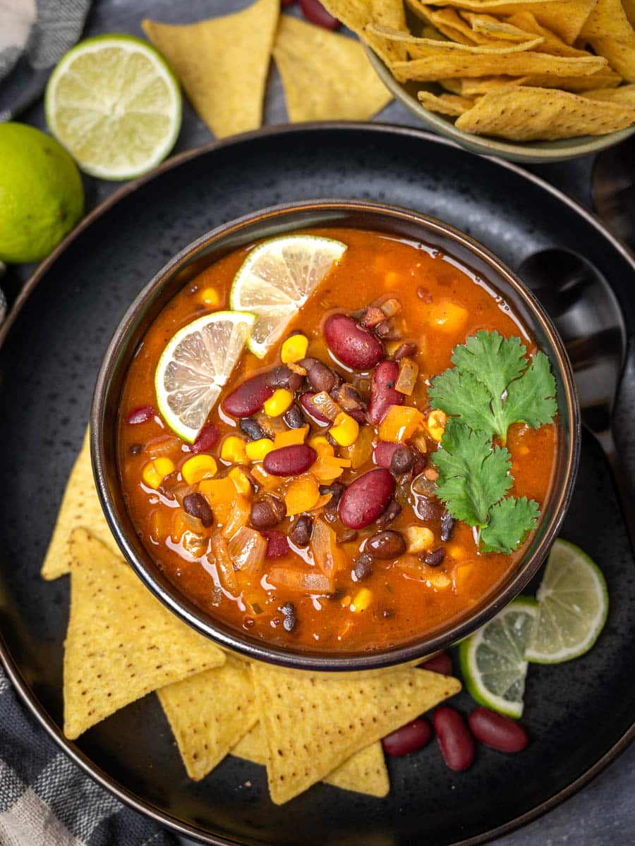 Mexican soup with tortilla chips on the side