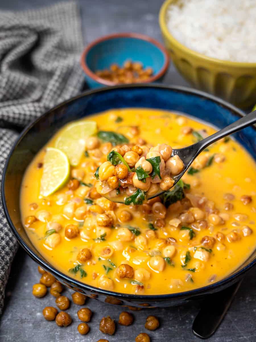 A close up photo of Thai curry soup