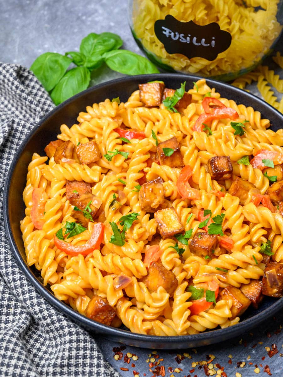 a plate of pasta with crispy tofu