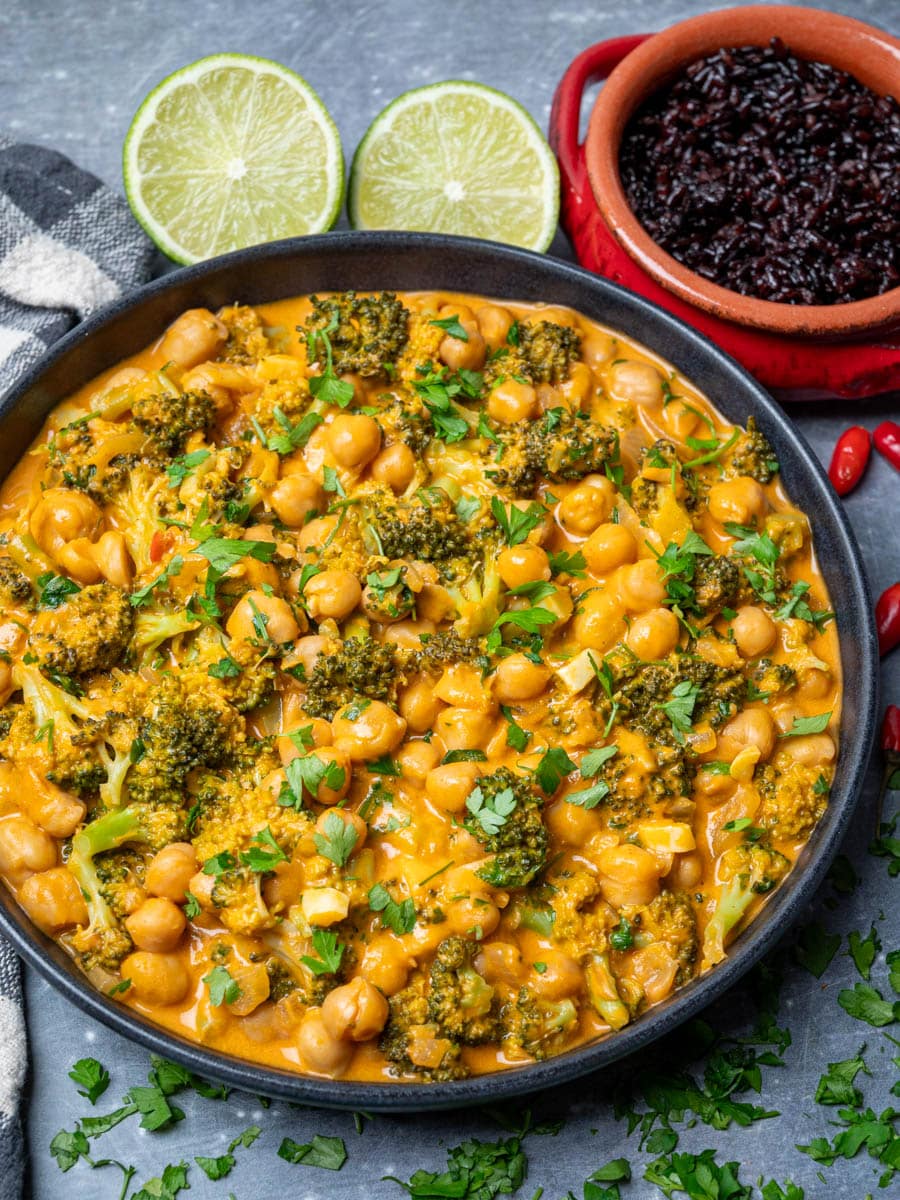 A bowl of vegan curry with chickpeas and broccoli