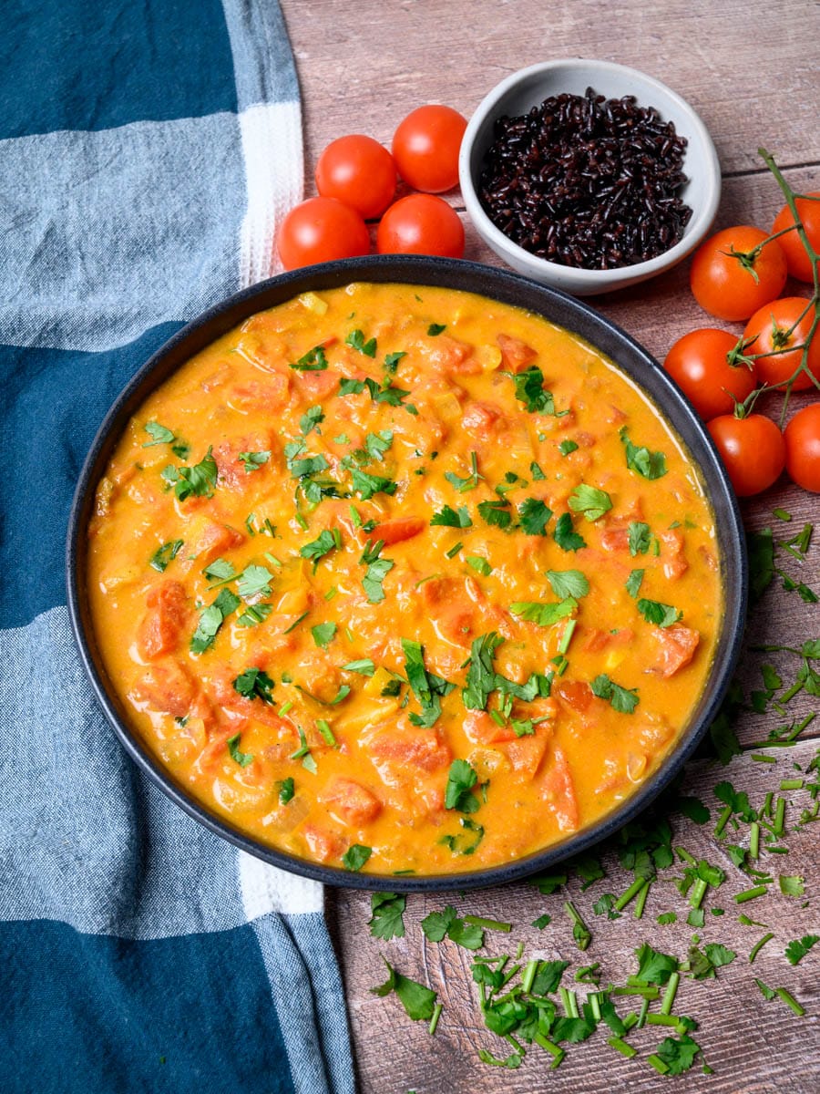 a plate of a tomato curry