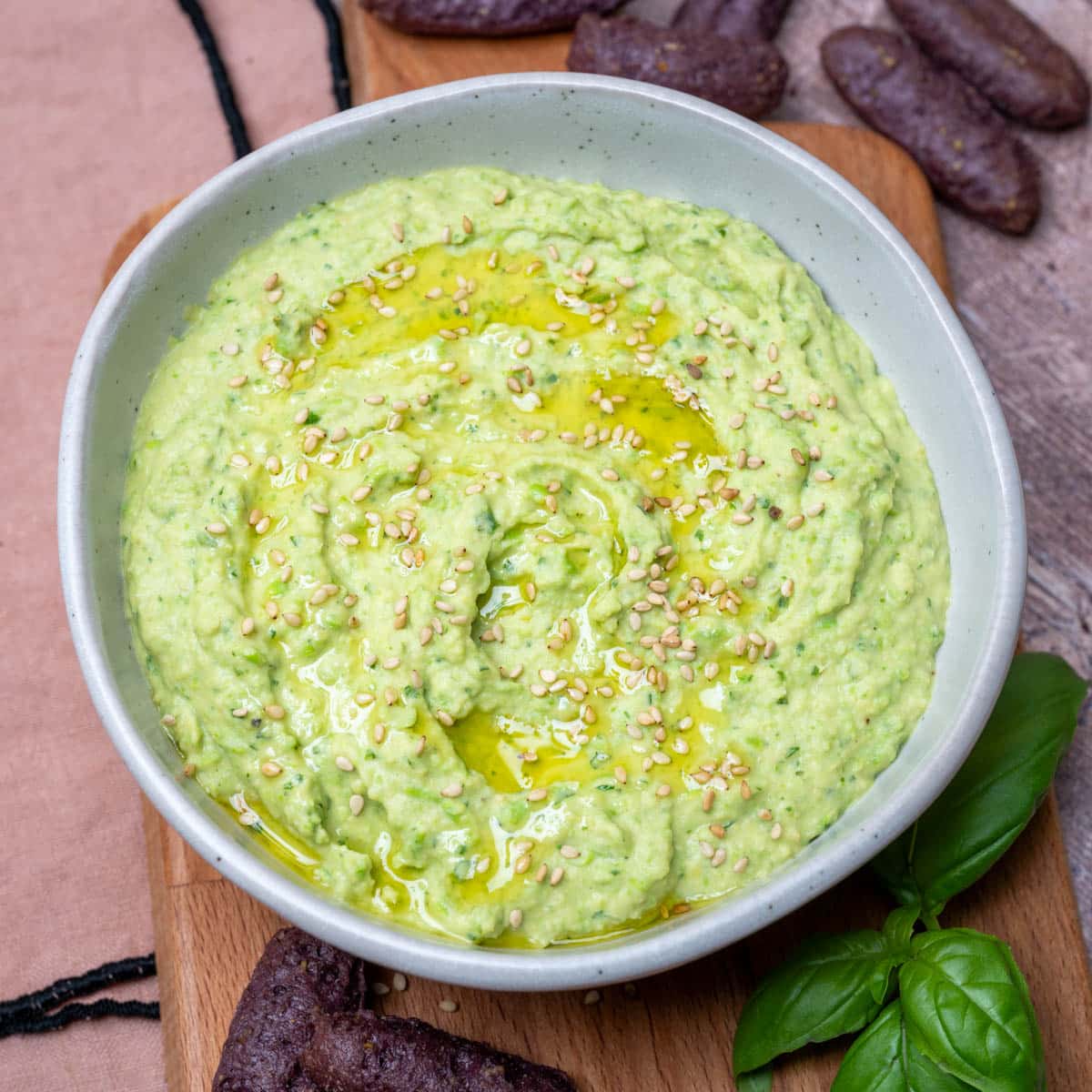 small bowl of a creamy dip made from chickpeas and tahini